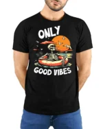 Only Good Vibes Skeleton Pool Float Sunset Graphic T Shirt - model wearing black tee with hands behind back