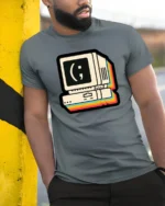 Retro Computer Smiley Face Coding Graphic T Shirt Vintage Tech Tee - model wearing grey tee, leaning on column
