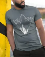 Minimalist Mountain Forest Triangle Graphic T Shirt Nature Style Tee - model wearing grey tee, leaning on column