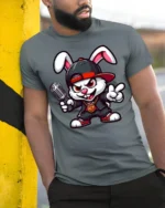 Funny Rapper Bunny With Microphone Hip Hop Graphic T Shirt - model wearing grey tee, leaning on column