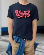 Groovy Pink Script Unique Typography Bold Retro Graphic Tshirt - model wearing navy tee with hands in pockets