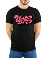 Groovy Pink Script Unique Typography Bold Retro Graphic Tshirt - model wearing black tee with hands behind back
