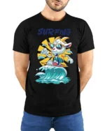Chill Surfing Goat Retro Sunset Waves Graphic Tshirt - model wearing black tee with hands behind back