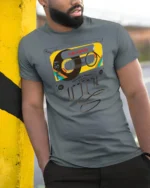 Nostalgic 80s Cassette Tape Memories Retro Graphic Tshirt - model wearing grey tee, leaning on column