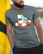 Jolly Shark Summer Vacation Hawaiian Shirt Graphic Tee - model wearing grey tee, leaning on column