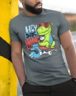 Radical Skater T Rex Hey Dude Gimme The 5 Graphic Tshirt - model wearing grey tee, leaning on column