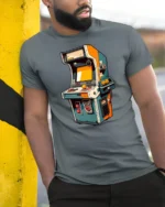 Retro Arcade Machine Joystick Classic Gaming Graphic Tshirt - model wearing grey tee, leaning on column