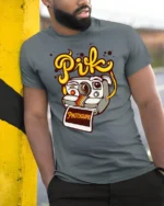 Vintage Camera Character Pik Photographe Graphic Tshirt - model wearing grey tee, leaning on column