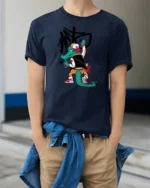 Graffitied Alligator Street Artist Varsity Jacket Graphic Tee - model wearing navy tee with hands in pockets