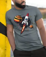 Galactic Rocket Ship Launch Retro Space Exploration Tshirt - model wearing grey tee, leaning on column