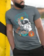 Cosmic Cereal Astronaut Milky Way Space Graphic Tshirt - model wearing grey tee, leaning on column