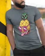 Zesty Pineapple Rockstar Pink Sunglasses Graphic Tshirt - model wearing grey tee, leaning on column