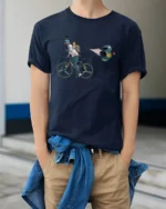 Speedy Bicycle Runner Game Over Parachute Graphic Tee - model wearing navy tee with hands in pockets