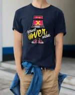 Funky Retro Arcade Machine Game Over Man Graphic Tshirt - model wearing navy tee with hands in pockets
