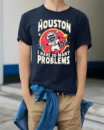 Relatable Astronaut Raccoon Houston Problem Space Tshirt - model wearing navy tee with hands in pockets