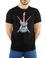 Teal Rock Monster Guitar Crossed Drumsticks Graphic Tshirt - model wearing black tee with hands behind back