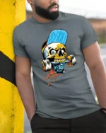 Asphalt Skater Skull Biting Skateboard Truck Graphic Tshirt - model wearing grey tee, leaning on column