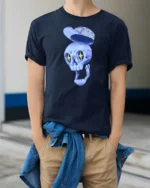 Dreamy Floating Blue Skull Floral Hat Graphic Tshirt - model wearing navy tee with hands in pockets