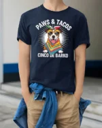 Festive Paws And Tacos Cinco De Barko Dog Graphic Tshirt - model wearing navy tee with hands in pockets