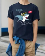 Groovy Shark Sunglasses Cool Dude Beach Vibe Graphic Tshirt - model wearing navy tee with hands in pockets