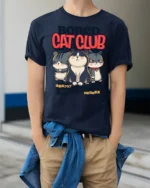 Gloomy Bored Cat Club Unimpressed Feline Graphic Tshirt - model wearing navy tee with hands in pockets
