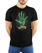 Creepy Monster Eye Palm Behold Mythical Graphic Tshirt - model wearing black tee with hands behind back