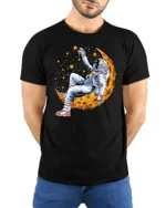 Celestial Dreamer Astronaut Reclining On Moon Graphic Tshirt - model wearing black tee with hands behind back
