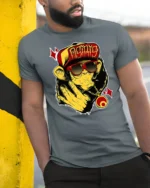 Urban Swag Monkey Graffiti Osiris Red Hat Graphic Tshirt - model wearing grey tee, leaning on column