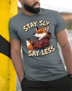 Cool Urban Fox Hoodie Stay Sly Say Less Slogan Graphic Tshirt - model wearing grey tee, leaning on column