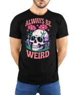Whimsical Always Be Weird Floral Skull Graphic Tshirt - model wearing black tee with hands behind back