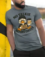 Grumpy Duck Coffee First No Talkie Relatable Tshirt - model wearing grey tee, leaning on column
