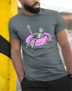 Chilled Summer Skeleton Floating Pink Tube Graphic Tshirt - model wearing grey tee, leaning on column
