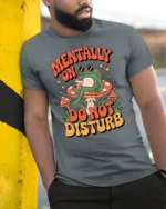 Relaxing Frog Mushroom Mentally On Do Not Disturb Tshirt - model wearing grey tee, leaning on column