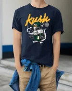 Dope Kush Ville Stoner Raccoon Smoking Blunt Graphic Tshirt - model wearing navy tee with hands in pockets