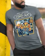Funny I Need A Break Cat Drinking Beer Graphic Tshirt - model wearing grey tee, leaning on column