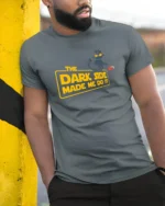 Funny Dark Side Black Cat Spilling Coffee Graphic Tshirt - model wearing grey tee, leaning on column
