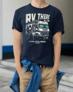 Funny RV There Yet Zombie Road Trip Graphic Tshirt - model wearing navy tee with hands in pockets