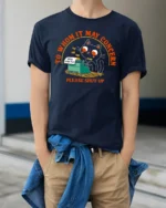 Funny Black Cat Typewriter Please Shut Up Graphic Tshirt - model wearing navy tee with hands in pockets