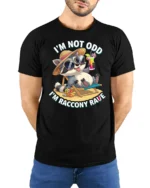 Chill Raccoon Sunglasses Summer Vacation Beach Graphic Tee - model wearing black tee with hands behind back