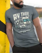Funny RV There Yet Zombie Road Trip Graphic Tshirt - model wearing grey tee, leaning on column