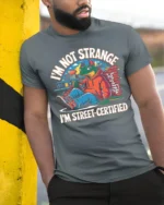 Funny Lizard Street Certified Urban Hoodie Graphic Tshirt - model wearing grey tee, leaning on column