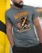 Funny Draw Your Weapons Battle Of The Artists Graphic Tee - model wearing grey tee, leaning on column