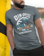 Funny Dinoarsaurus Wreks Sailor Dinosaur Graphic Tshirt - model wearing grey tee, leaning on column