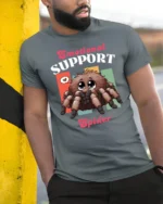 Cute Emotional Support Spider Fluffy Tarantula Graphic Tee - model wearing grey tee, leaning on column