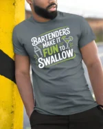 Funny Bartenders Make It Fun To Swallow Slogan Cocktail Tshirt - model wearing grey tee, leaning on column