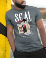 Seal The Deal Detective Fish Mobster Pun Graphic Tshirt - model wearing grey tee, leaning on column
