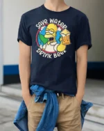 Save Water Drink Beer Character Earth Graphic Tshirt - model wearing navy tee with hands in pockets