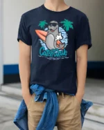 Cool Surfing Seal Catch The Wave Beach Graphic Tshirt - model wearing navy tee with hands in pockets