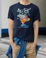 Cool Surfing Shark Hawaiian Shirt Sunglasses Graphic Tee - model wearing navy tee with hands in pockets