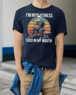 Funny Fitness Skeleton Taco In My Mouth Sunset Graphic Tee - model wearing navy tee with hands in pockets
